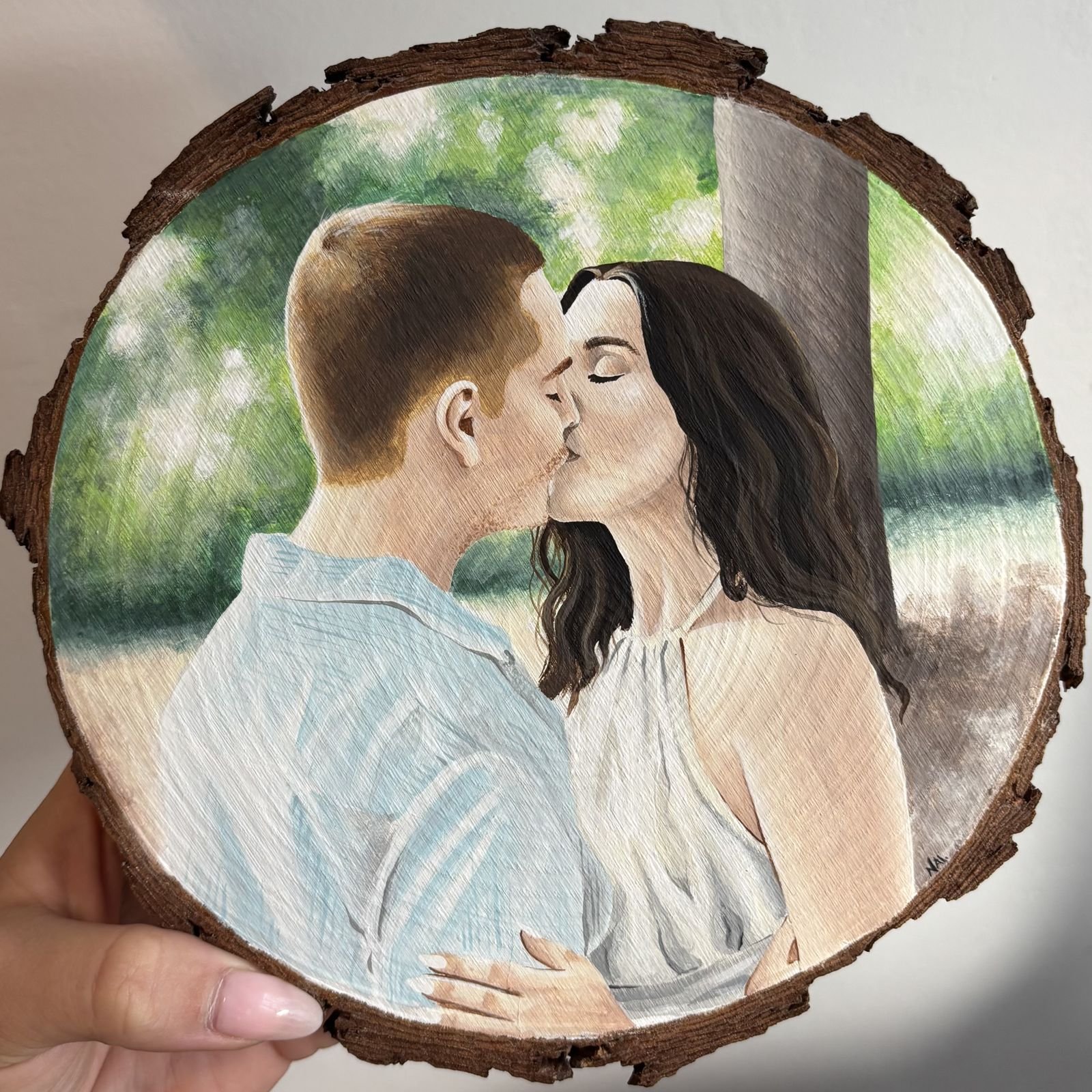 Retrato de pareja en acuarela sobre madera